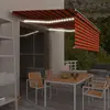 Image de vidaXL Auvent manuel rétractable et store et LED 4,5x3 m Orange/marron