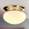 Image de Orion Plafonnier Delia laiton, verre crème