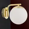Image de Orion Applique Madis avec sphère en verre, laiton mat