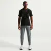 Image de Nike Dri-FIT Stride Woven Running Pants T. L Gris Homme