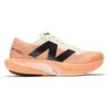 Image de Chaussures de running - NEW BALANCE - FuelCell Rebel v4 (WFCXCC4) - Orange/Blanc - FuelCell réactive - Tige en maille