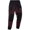 Image de Pantalon long Mountain Hardwear Polartec High Loft rouge foncé noir femme - S