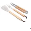 Image de SET BARBECUE 3 PIECES MANCHES BOIS A SUSPENDRE- ESSENTIELS - PRADEL EXCELLENCE - FOURCHETTE - SPATULE - PINCE