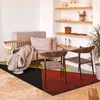 Image de Tapis lumineux effet laineux motifs triangles multicolore 120x170