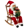 Image de Père Noël habit traditionnel Rouge et Blanc assis dans son rocking chair H 40 cm - Feeric Christmas