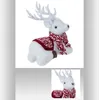 Image de Décoration à poser - FEERIC LIGHT & CHRISTMAS - Renne - Polyfoam - Écharpe rouge et blanche - Intérieur
