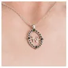 Image de Collier fantaisie réversible Mercredi/W noir   pendentif ovale pierres noires