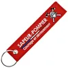 Image de CLJ - Porte-clés - Sapeur Pompier - Casque et Haches - Rouge Pompier - Métiers -