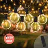 Image de Guirlande Guinguette Led 30m 50 Bulbes Rond Blanc Chaud Dimmable