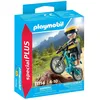 Image de Cycliste avec vélo tout terrain et souche darbre