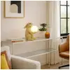 Image de lampe lapin assis doré