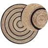 Image de Tapis rond tressé 140 cm beige et noir BUKSE