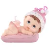 Image de Figurine petite fille sur un coussin 9 cm - Rose