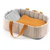 Image de Accessoire pour poupon Poméa 32 cm : Couffin Blue Lines Djeco-DJ07845