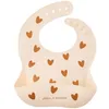 Image de Bavoir en silicone Coeurs Crème