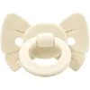 Image de Sucette orthodontique en silicone Binky Bow Oat White (0 mois et +)
