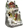 Image de Village de Noël Père-Noël et chalet à la montagne lumineux