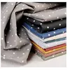 Image de Tissu coton imprimé pois blancs vendu au mètre(...) - poisrouge