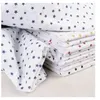 Image de Tissu coton étoilé sur fond blanc vendu au mètre(...) - étoilegris