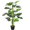 Image de Arbre artificiel plante artificielle Monstera H. 100 cm tronc branches lichen feuilles de tortue grand réalisme pot inclus