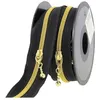 Image de Fermeture à glissière Spirale N°4 avec tirettes rondes - Milward(...) - Noir et Or