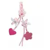 Image de Hochet berceau porte tetine fleurs roses