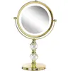 Image de Beliani, Miroir cosmétique, miroir cosmétique doré avec éclairage LED ø 18 cm CLAIRA