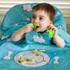 Image de Bavoir intégral couvrant bébé et chaise haute