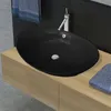 Image de Lavabo ovale en céramique noir avec trop plein 59 x 38,5 cm