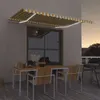 Image de vidaXL Luifel handmatig uittrekbaar met LED 400x300 cm geel en wit3068903