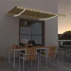 Image de vidaXL Luifel handmatig uittrekbaar met LED 450x300 cm geel en wit3068923