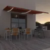 Image de vidaXL Luifel handmatig uittrekbaar met LED 600x300 cm oranje en bruin3068965