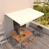 Image de vidaXL Luifel handmatig uittrekbaar 500x350 cm cràmekleurig3069017