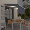 Image de vidaXL Luifel handmatig uittrekbaar rolgordijn LED 3,5x2,5 m blauw wit3069401