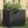 Image de Jardinière noir 36x30x32 cm résine tressée