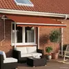 Image de vidaXL Auvent manuel rétractable avec poteaux 3,5x2,5 m Orange marron