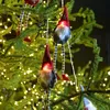 Image de Guirlande lumineuse de noël pères noël à piles led blanc chaud 2 m