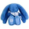 Image de Peluche lapin fleurette bleu 25 cm