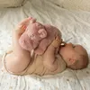 Image de Peluche musicale bébé rose