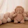 Image de Peluche musicale bébé léo le lion beige