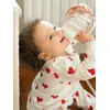 Image de Biberon d'apprentissage 2 en 1 (210 ml) rose
