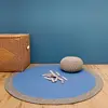 Image de Tapis Rond Laine Tressé Nolan Bleu