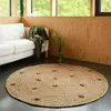 Image de Tapis Rond Jute Avec Pompons Siska Marron