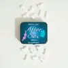 Image de Pastilles à la menthe dans leur boîte coquine -