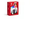 Image de Switch (modèle OLED) avec station d'accueil et manettes Joy-Con blanches