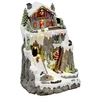 Image de Village de Noël Père-Noël et chalet à la montagne lumineux