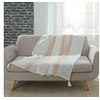 Image de Plaid à pompons coton tissé Indira rose 125x150 cm