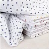 Image de Tissu coton étoilé sur fond blanc vendu au mètre(...) - étoilerouge
