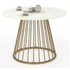 Image de Table à manger ronde YUNA 6 personnes plateau effet marbre blanc ALASKA pied filaire laiton 110 cm