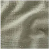 Image de TISSU GLIT DOUBLE GAZE PAILLETE OR vendu au mètre(...) - Vert